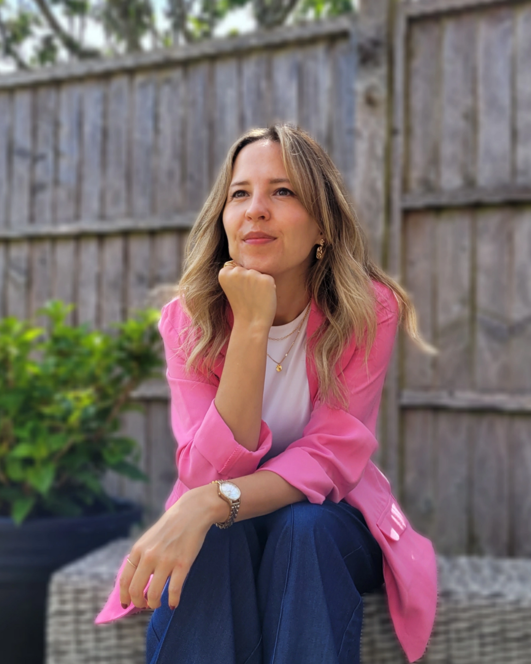 Portrait image of Jess the Virtual Assistant in the garden.